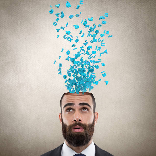 istock Businessman with alphabets emerging out from his head 831363794