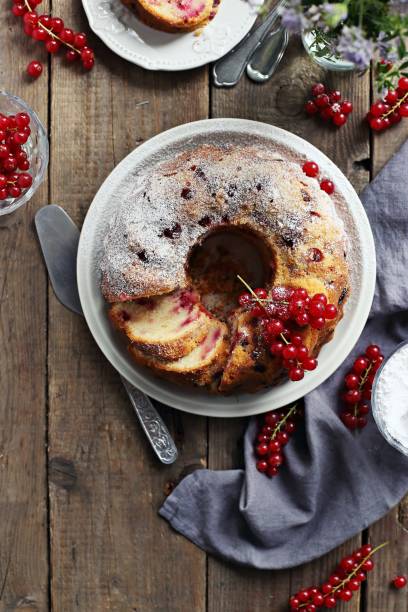 istock Bundt cake with fresh red currant. Overhead view. 831367442