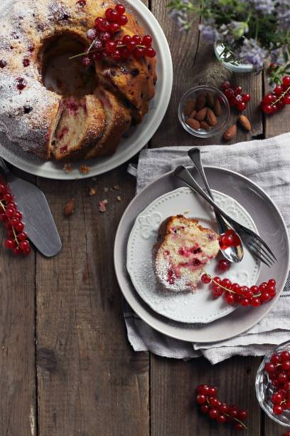 istock Bundt cake with fresh red currant. Overhead view. 831367520