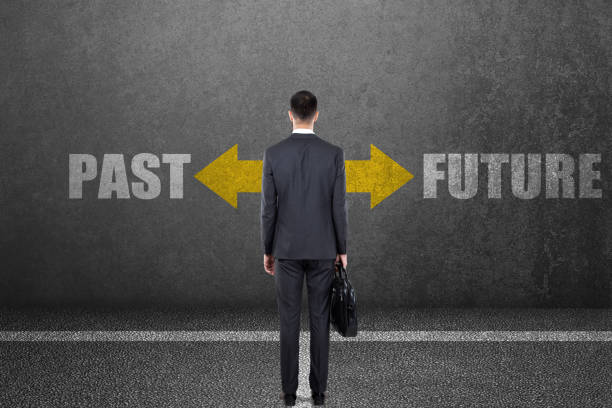 istock Businessman with past or future choice on wall 831367602