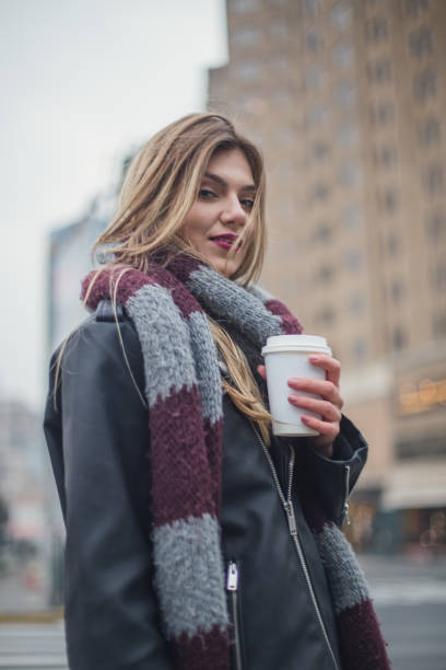 istock Cute girl with a coffee to go 831371074