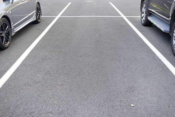 istock space between cars in parking lot 831372152