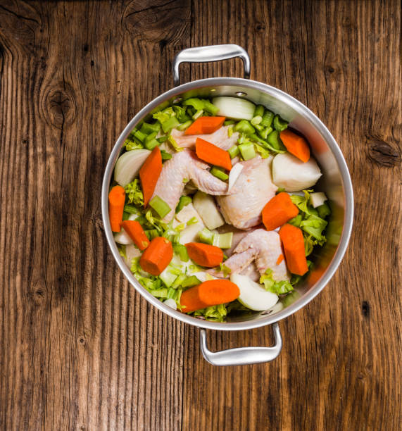 istock Metal stock pot with soup ingredients 831379118