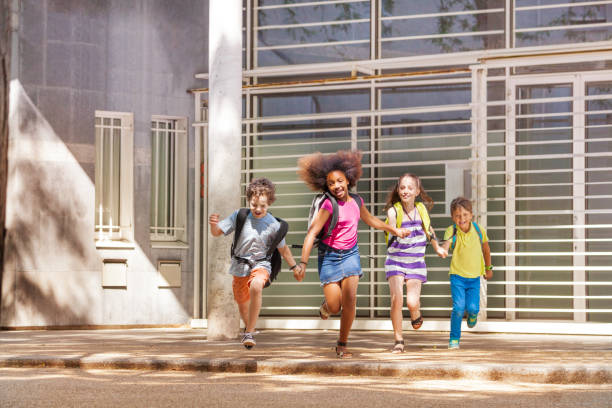 istock Group of happy run after school 831382264