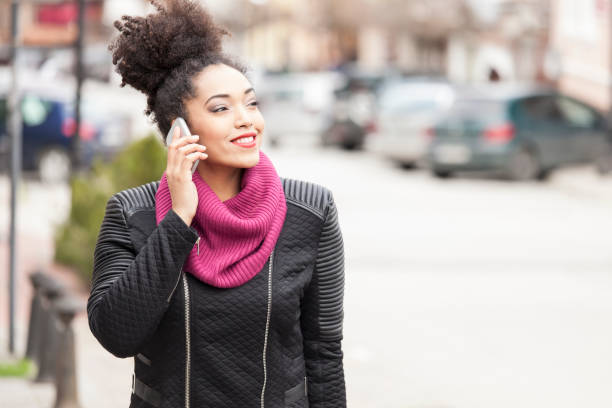 istock Beautiful woman talking on smart phone 831382834