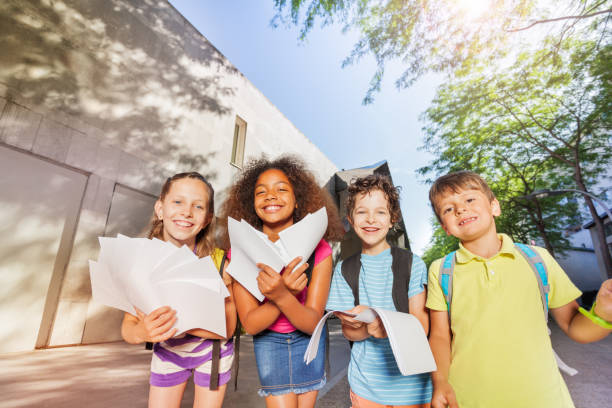 istock Happy school kids bend to the camera 831383254