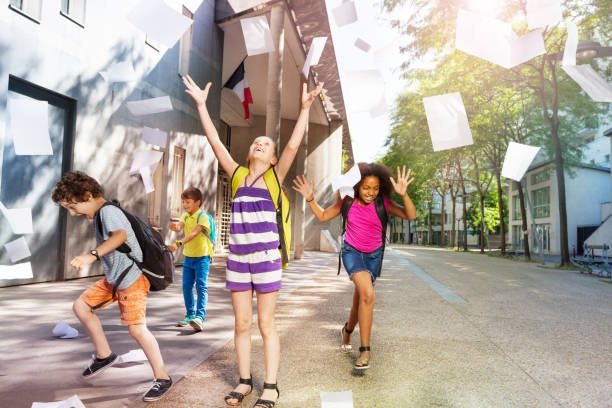 istock Kids having fun in the school yard 831383766