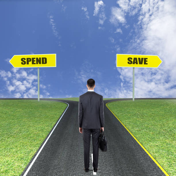 istock Businessman thinking to save or to spend 831387256