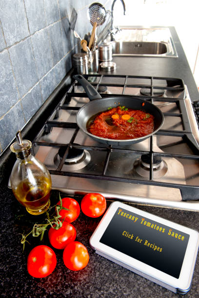 istock Tomatoes sauce cooking Recipes on Tablet 831389540