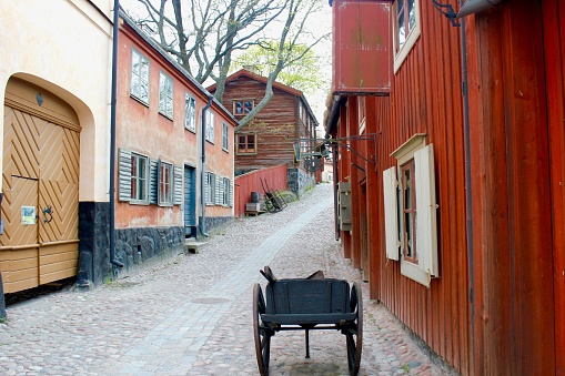 A rural village street with cart in Skansen, Stockholm. April 29th, 2014.