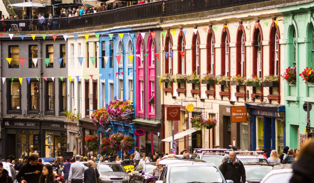 Tourists crowd into Victoria Street, Edinburgh. stock photo