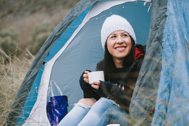 istock Young woman in a tent 831412158