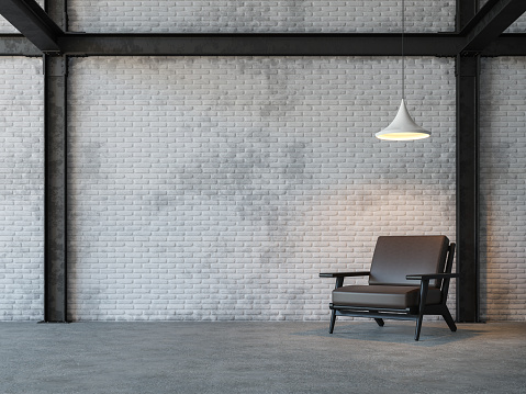 Loft style living room 3d rendering image.There are white brick wall,polished concrete floor and black steel structure.Furnished with dark brown leather armchair