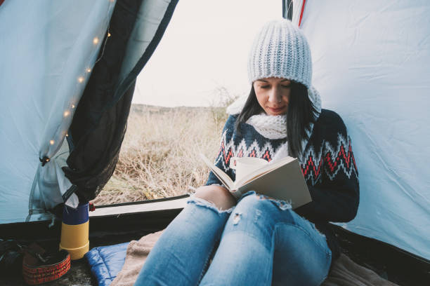 istock Young woman in a tent 831414590