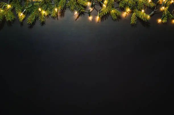 Photo of Christmas decoration background over black chalkboard