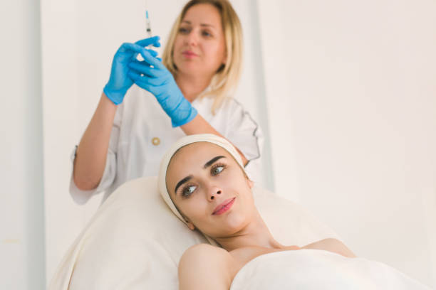 istock Doctor making botox facial injection. 831415104