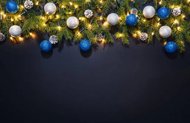 Photo of Christmas decoration background over black chalkboard