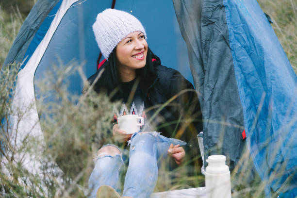 istock Young woman in a tent 831415356