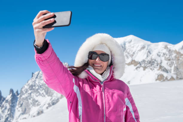 istock Woman taking selfie with snow 831415456