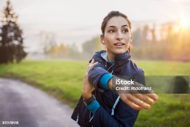 Woman Working Out Stock Photo - Download Image Now - Women, One Woman Only, Stretching