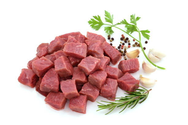 istock Raw meat, beef steak sliced in cubes isolated on white background 831422444