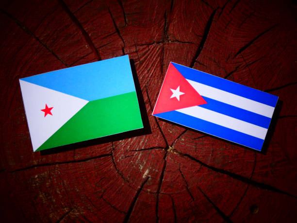 Djibouti flag with Cuban flag on a tree stump isolated Djibouti flag with Cuban flag on a tree stump isolated flag of djibouti stock pictures, royalty-free photos & images