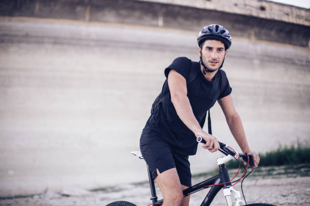 istock Man cyclist riding bike 831432894