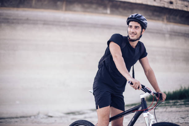 istock Man cyclist riding mountain bike 831433048