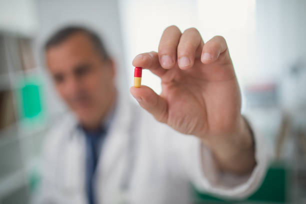 istock Doctor holding a pill 831434250