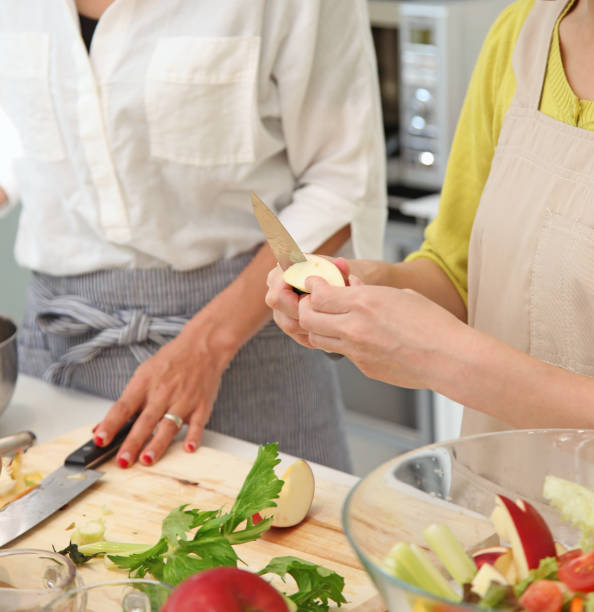 istock women cooking in kitchen 831440260