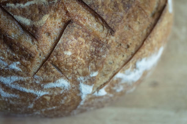 Close-up of garlic bread on wooden background