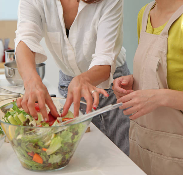 istock women cooking in kitchen 831446982