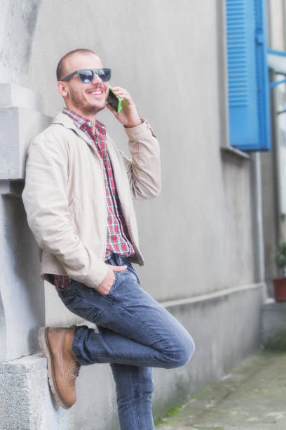 istock Urban guy talking on the phone outdoors. 831449344