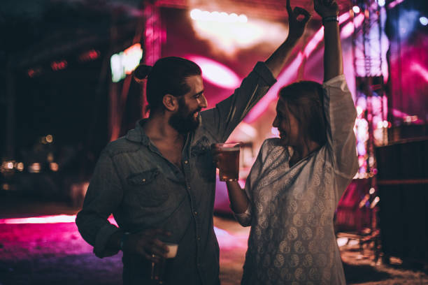 istock Couple dancing on concert 831449626