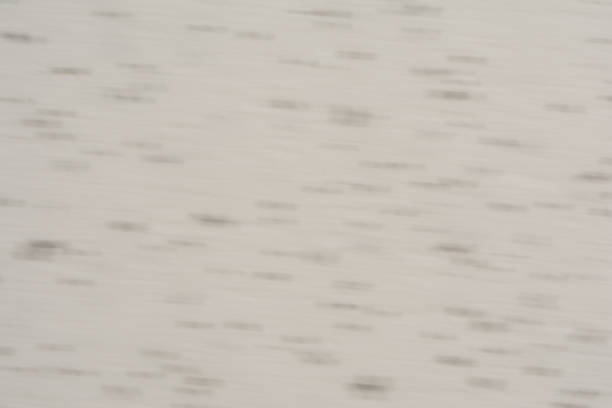 istock Blurred texture polyester foam consisting of white and black balls, motion effect 831452432
