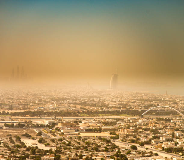 sand storm in dubai - fog desert arabia sunset stock-fotos und bilder