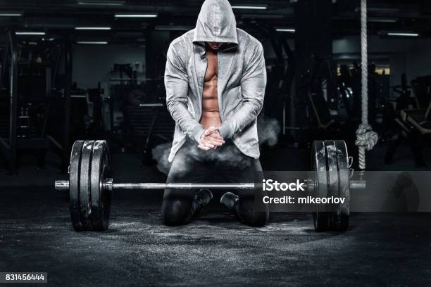 Muscular Young Fitness Sports Man Workout With Barbell In Fitness Gym Stock Photo - Download Image Now