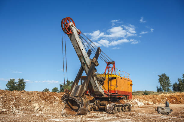 istock Big industrial orange quarry excavator on construction site 831459090
