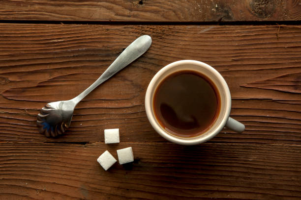 istock Cup of coffee and sugar cubes. 831462544