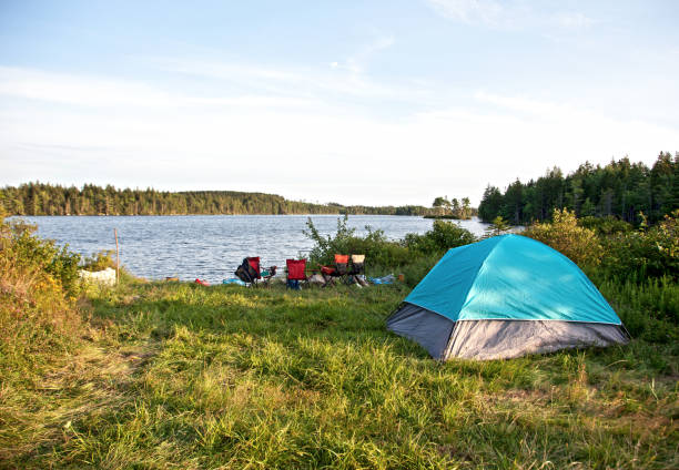 istock summer lake view with tent 831462578