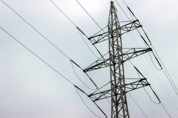 istock high voltage electrical towers in line. sky background 831472302