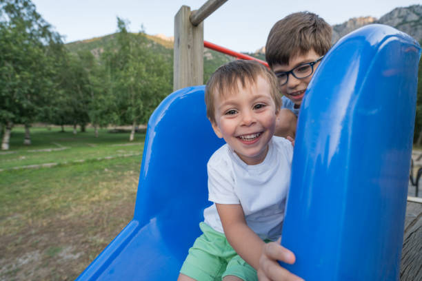 istock Children playing in the park at playground and communicating 831478088