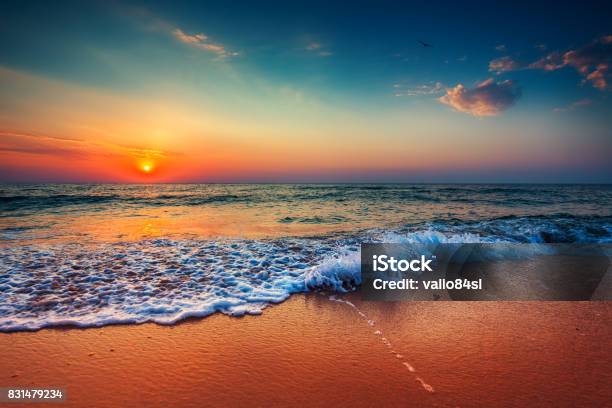Beautiful Cloudscape Over The Sea Sunrise Shot Stock Photo - Download Image Now - Sunset, Beach, Sea