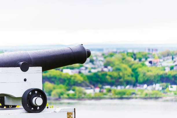 istock Cannon in Quebec City, Canada in plaines d'Abraham overlooking the Saint Lawrence river and Levis town 831481302