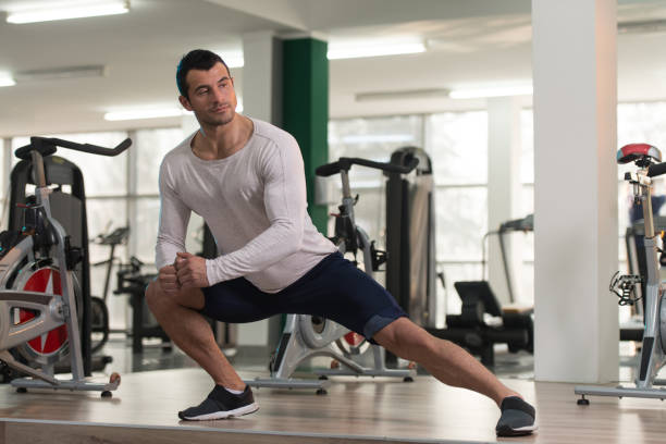 istock Healthy Man Stretches At The Floor 831487104