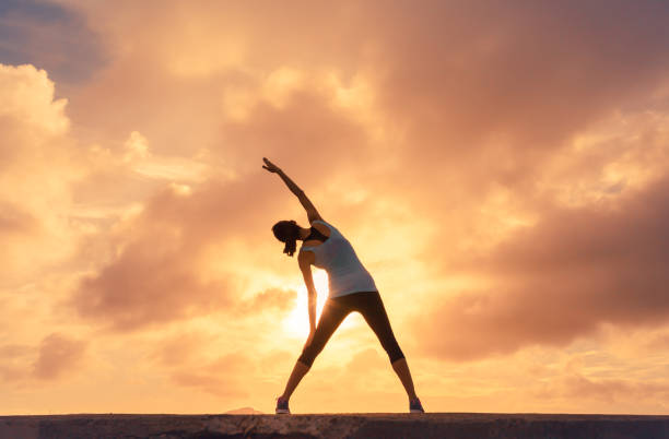 istock Woman stretching outdoors 831498882