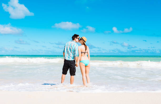 istock Couple kissing on the beach 831498902