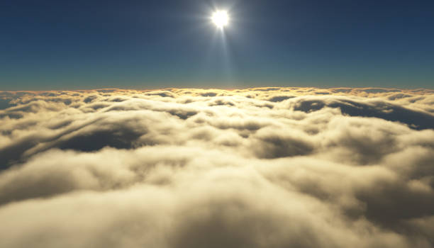 istock View of a cloudy sunrise while flying above the clouds. 831499034