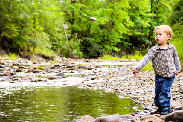 istock Happy Child in Nature by River 831499220