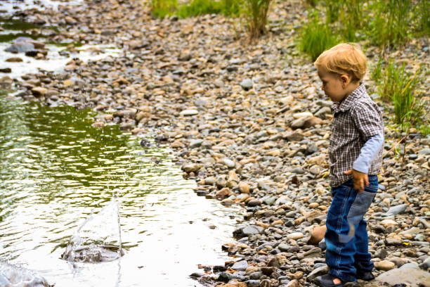 istock Happy Child in Nature by River 831499280